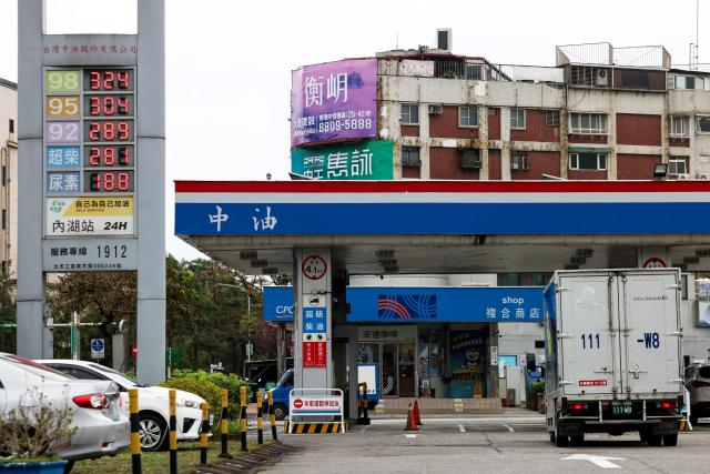 A motorist drives into a gas station in Taipei on March 9, 2026. The price of the main US benchmark for oil surged more than 30 percent on March 9, 2026 over concerns that the Middle East war could create prolonged supply disruptions. (Photo by I-Hwa Cheng / AFP)
