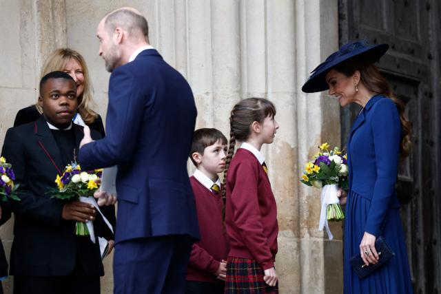 Britain's Prince William, Prince of Wales (3L) and Britain's Catherine, Princess of Wales (R) speak with children as they depart after the annual Commonwealth Day service ceremony at Westminster Abbey in London, on March 9, 2026. (Photo by Brook Mitchell / AFP)