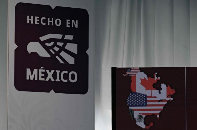 View of the Mexican logo "Hecho en Mexico" (Made in Mexico) next to the map of North America, during an event to announce the results of the public consultation on the United States-Mexico-Canada Agreement (USMCA), at the offices of the Ministry of Economy, in Mexico City on March 9, 2026. Mexican business leaders on March 9 listed the "unilateral" measures imposed by the United States and the trade "asymmetries" with Mexico as their main concerns regarding the North American free trade agreement (T-MEC), in a report prepared ahead of its upcoming review. (Photo by Alfredo ESTRELLA / AFP)
