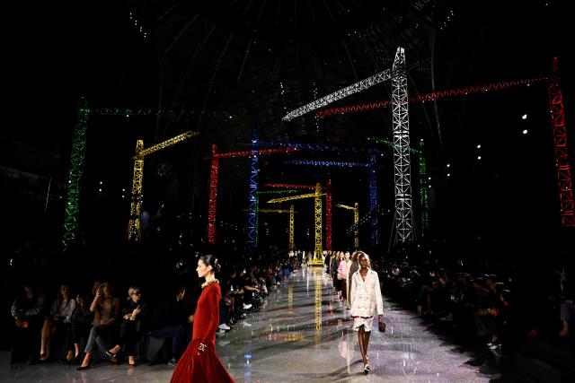Models present creations for Chanel for the Women's Ready to Wear Fall/Winter 2026-2027 collection fashion show at The Grand Palais as part of the Paris Women Fashion Week, in Paris, on March 9, 2026. (Photo by JULIEN DE ROSA / AFP)