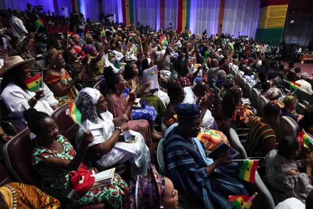 Members of the "historical diaspora" attends the swearing-in ceremony where they took the oath of allegiance to become Ghanaian citizens in Accra, Ghana, on March 9, 2026. Ghana has sought to position itself as a prime destination for the African diaspora, which it describes as the country's "17th region", and has set up initiatives to attract descendants of enslaved Africans. (Photo by Nipah Dennis / AFP)