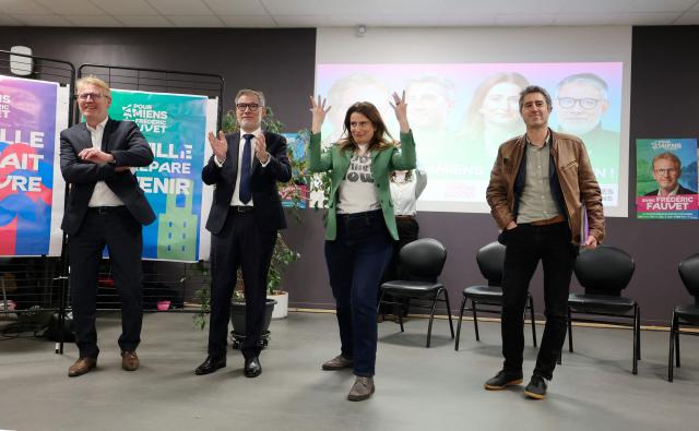 French Socialist party (PS) first secretary Olivier Faure (2ndL), National secretary of French left-wing party The Ecologistes Marine Tondelier (2ndR) and Ecologiste et Social's MP Francois Ruffin (R) react next to the candidate in the municipal elections in Amiens, Frederic Fauvet (L), in Amiens, northern France, on March 9, 2026. (Photo by Francois LO PRESTI / AFP)