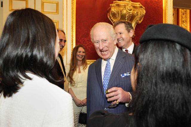 Britain's King Charles III speaks with guests during the annual Commonwealth Day Reception at St James's Palace in London on March 9, 2026. (Photo by Aaron Chown / POOL / AFP)