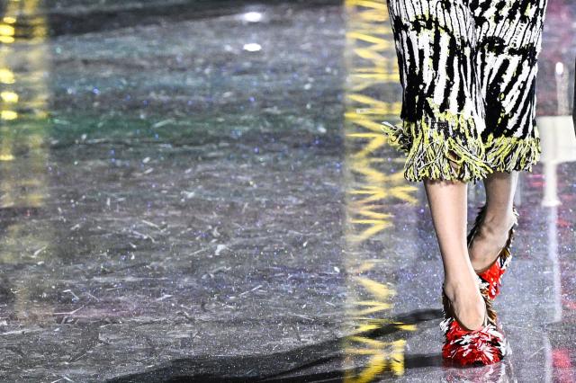 A model presents a paire of shoes for Chanel for the Women's Ready to Wear Fall/Winter 2026-2027 collection fashion show as part of the Paris Women Fashion Week, in Paris, on March 9, 2026. (Photo by JULIEN DE ROSA / AFP)
