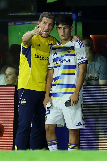(FILES) Boca Juniors' head coach Claudio Ubeda gives instructions to Boca Juniors' midfielder #36 Tomas Aranda during the Argentine Professional Football League 2026 Apertura Tournament match between Boca Juniors and Platense at La Bombonera Stadium in Buenos Aires on February 15, 2026. On the most difficult night, when criticism was mounting, Boca Juniors found in the skilful youngster Tomas Aranda the weapon to stay afloat amid a slump that had put manager Claudio Ubeda on the ropes. The coach's continuity will be put to the test on March 11, 2026 when they host San Lorenzo on the tenth matchday of the Apertura tournament. (Photo by ALEJANDRO PAGNI / AFP)
