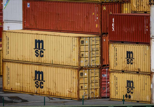 (FILES) Containers of MSC shipping lines stand at the harbour of Bremerhaven, northern Germany, on June 12, 2025. Global shipping giant MSC announced on March 9, 2026 it was formally halting certain export shipments from the Gulf because of the Middle East war and that "all affected cargo will be discharged". (Photo by FOCKE STRANGMANN / AFP)