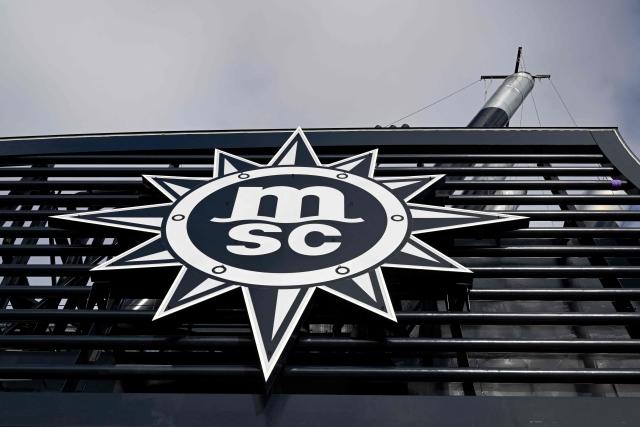 (FILES) This photograph taken on October 24, 2022, shows an MSC logo on the Ocean liner MSC World Europa, equipped with a liquified natural gas (LNG) propulsion system, during its delivery ceremony at Saint-Nazaire's harbour, western France. Global shipping giant MSC announced on March 9, 2026 it was formally halting certain export shipments from the Gulf because of the Middle East war and that "all affected cargo will be discharged". (Photo by DAMIEN MEYER / AFP)