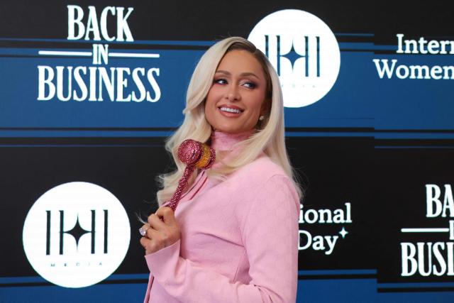 US socialite Paris Hilton rings the closing bell on the floor of the New York Stock Exchange (NYSE) during International Womens Day in New York on March, 9 2026. Wall Street stocks vaulted into positive territory after President Donald Trump described the US-Israeli war with Iran as "pretty much" over without giving details of any solution to the conflict still raging in the Middle East. All three major indices moved suddenly higher after the comments were reported, with the Dow Jones Industrial Average finishing 0.5 percent up at 47,740.80, a swing of 1,125 points from earlier in the day. (Photo by ANGELA WEISS / AFP)