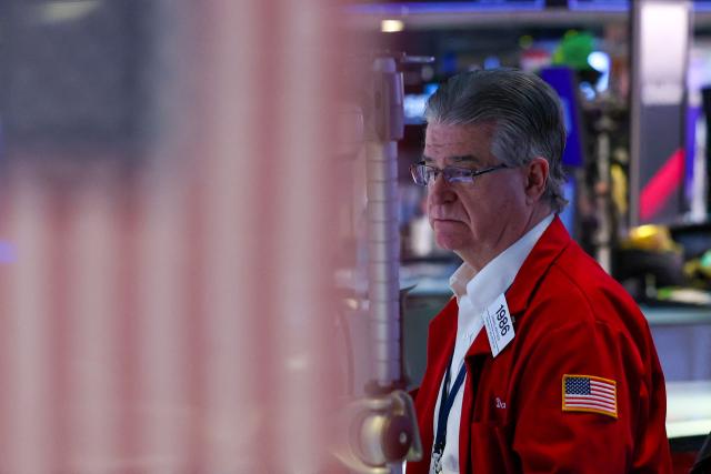 A trader works on the floor of the New York Stock Exchange (NYSE) during International Womens Day on March 9, 2026 in New York City. Wall Street stocks vaulted into positive territory after President Donald Trump described the US-Israeli war with Iran as "pretty much" over without giving details of any solution to the conflict still raging in the Middle East. All three major indices moved suddenly higher after the comments were reported, with the Dow Jones Industrial Average finishing 0.5 percent up at 47,740.80, a swing of 1,125 points from earlier in the day. (Photo by ANGELA WEISS / AFP)