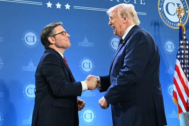 US President Donald Trump shakes hands with the Speaker of the House Mike Johnson, Republican of Louisiana, during the Republican Members Issues Conference at Trump National Doral in Miami, Florida, on March 9, 2026. (Photo by SAUL LOEB / AFP)