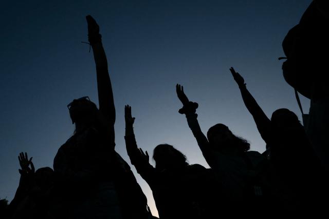 Women demonstrate during a march as part of the International Women's Day in Buenos Aires on March 9, 2026. The march was convened by feminist organizations to press historic demands against gender-based violence, to defend labor rights, and to oppose the economic austerity policies of Argentina’s President Javier Milei. (Photo by Luis ROBAYO / AFP)