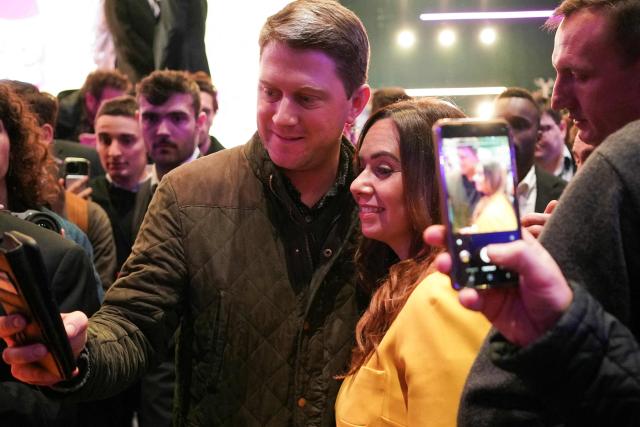 French far-right party Reconquete! MEP and candidate for mayor of Paris Sarah Knafo (C) takes selfies with supporters at the end of her campaign meeting at the Dome de Paris venue in Paris on March 9, 2026. (Photo by Dimitar DILKOFF / AFP)