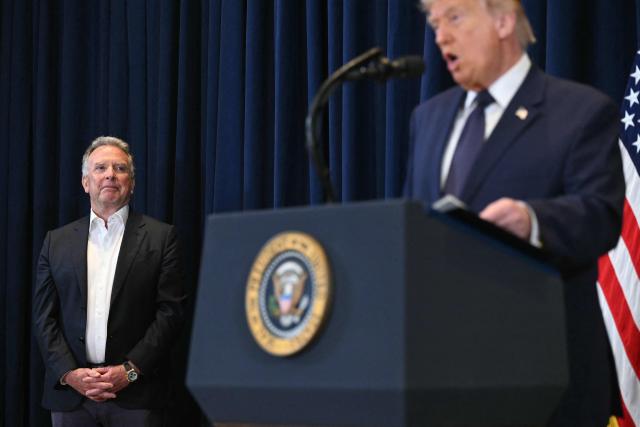 US Special Envoy to the Middle East Steve Witkoff (L) listens to US President Donald Trump as he speaks during the press conference of the Republican Members Issues Conference at Trump National Doral in Miami, Florida, on March 9, 2026. (Photo by SAUL LOEB / AFP)
