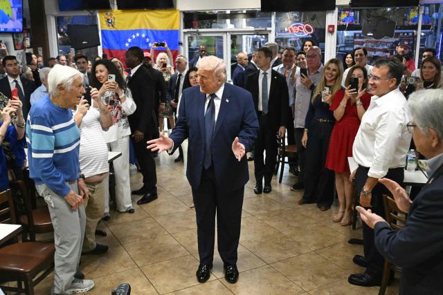 US President Donald Trump speaks with supporters at Venezuelan restaurant El Arepazo in Miami, Florida, March 9, 2026. (Photo by SAUL LOEB / AFP)
