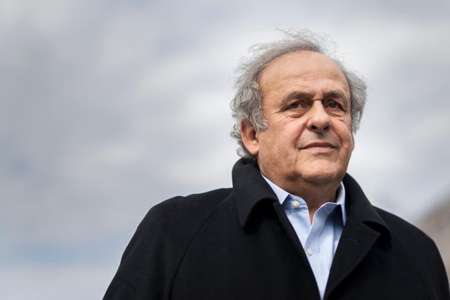 (FILES) Former UEFA president Michel Platini looks on when leaving the courthouse after the verdict of an appeal by Swiss Attorney General's office against former UEFA and FIFA presidents over a suspected fraudulent payment, in Muttenz near Basel, on March 25, 2025. Former UEFA president Michel Platini, who has filed a defamation suit against three former FIFA officials, said on March 9, 2026 that he was determined ‘not to let go of the people who have hurt [him]’. (Photo by Fabrice COFFRINI / AFP)