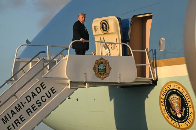 US President Donald Trump boards Air Force One at Miami International Airport in Miami, Florida, on March 9, 2026, as he travels back to Washington, DC. (Photo by SAUL LOEB / AFP)