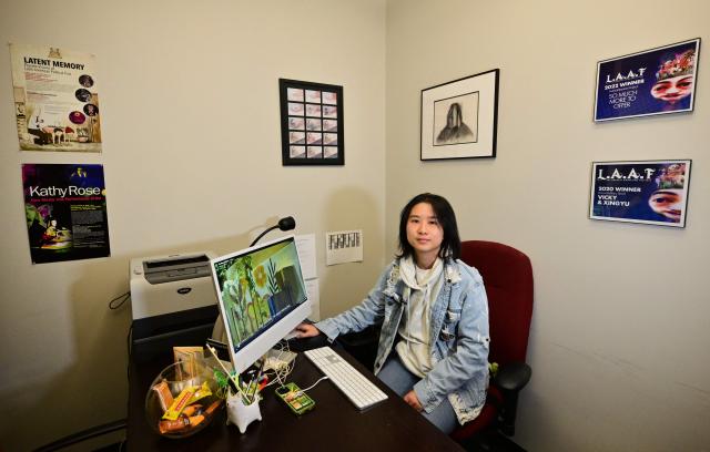 Xindi Zhang, a recent graduate of USC and winner of a Student Academy Award for her short film "The Song of Drifters", poses for a photo at the University of Southern California in Los Angeles, on March 6, 2026. Studying at the film school where Oscar-nominated "Sinners" director Ryan Coogler honed his craft, some students dream of winning an Academy Award. Now with the recent developments in artificial intelligence, they can see a shortcut to achieving their ambition. (Photo by Frederic J. BROWN / AFP)
