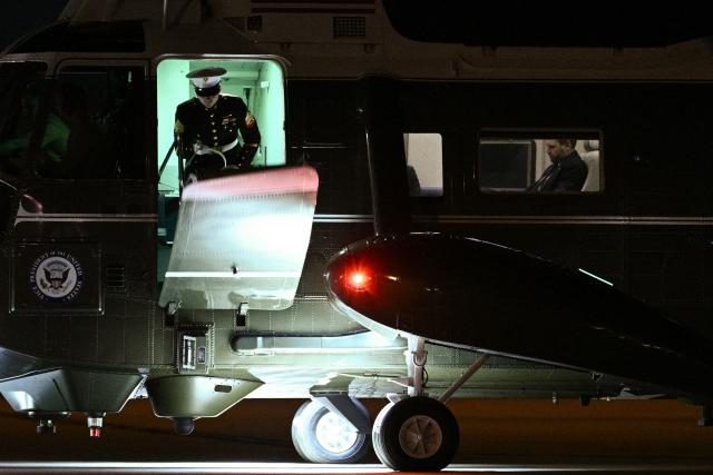 US Vice President JD Vance sits aboard Marine Two as he returns to Joint Base Andrews, Maryland on March 9, 2026 after attending a dignified transfer solemn event for Sgt. Benjamin N. Pennington, 26, of Glendale, Kentucky, at Dover Air Force Base. (Photo by Brendan SMIALOWSKI / AFP)