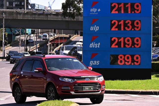 A sign outside a fuel station in Melbourne on March 10, 2026 shows the soaring price of petrol and diesel prices due to the Middle East conflict. Global oil prices have climbed dramatically since the war, prompting warnings that high fuel prices could drive inflation above 5 per cent in Australia. (Photo by William WEST / AFP)