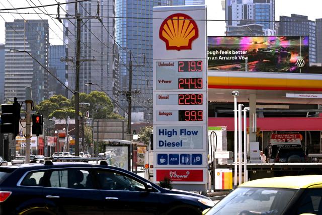 A sign outside a fuel station in Melbourne on March 10, 2026 shows the soaring price of petrol and diesel prices due to the Middle East conflict. Global oil prices have climbed dramatically since the war, prompting warnings that high fuel prices could drive inflation above 5 per cent in Australia. (Photo by William WEST / AFP)