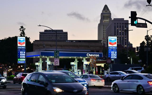 Commuters drive past a Chevron gas station in Los Angeles on March 9, 2026, as gasoline prices surge amid the ongoing war with Iran. The Iran war has sent oil prices soaring on March 9 after Tehran, under new leader Mojtaba Khamenei, fired a new barrage of missiles at its Gulf neighbours and signalled that the strategic Strait of Hormuz would likely remain shut. (Photo by Frederic J. BROWN / AFP)