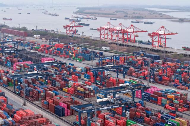 Cargo containers are seen in Nanjing port, in China’s eastern Jiangsu province on March 10, 2026. (Photo by CN-STR / AFP) / China OUT