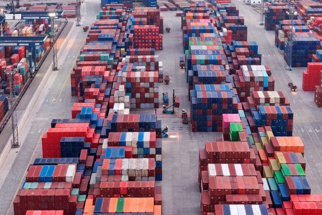 Cargo containers are seen in Nanjing port, in China’s eastern Jiangsu province on March 10, 2026. (Photo by CN-STR / AFP) / China OUT