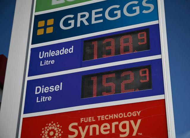 The price per litre of unleaded petrol and diesel fuels are pictured outside an Esso petrol station in Lutterworth, near Rugby in central England, on March 10, 2026. Oil and gas prices tumbled after US President Donald Trump said "I think the war is very complete, pretty much". World oil prices dropped by around eight percent, while the European benchmark gas price, the Dutch TTF natural gas contract, fell around 15 percent. (Photo by Oli SCARFF / AFP)