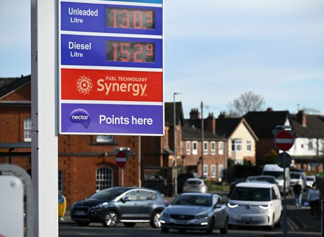 The price per litre of unleaded petrol and diesel fuels are pictured outside an Esso petrol station in Lutterworth, near Rugby in central England, on March 10, 2026. Oil and gas prices tumbled after US President Donald Trump said "I think the war is very complete, pretty much". World oil prices dropped by around eight percent, while the European benchmark gas price, the Dutch TTF natural gas contract, fell around 15 percent. (Photo by Oli SCARFF / AFP)