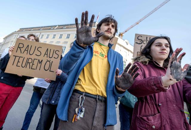 Fridays for Future activists protest outside the Federal Chancellery in Vienna on March 10, 2026, calling for a climate-friendly June budget without oil and gas subsidies. As crude oil prices rise, the impact goes far beyond Austria’s petrol stations, since the long-term costs of fossil-fuel investments are far higher due to global-warming impacts. (Photo by Joe Klamar / AFP)