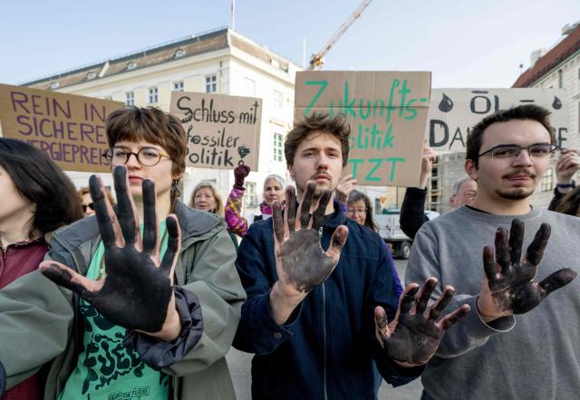 Fridays for Future activists protest outside the Federal Chancellery in Vienna on March 10, 2026, calling for a climate-friendly June budget without oil and gas subsidies. As crude oil prices rise, the impact goes far beyond Austria’s petrol stations, since the long-term costs of fossil-fuel investments are far higher due to global-warming impacts. (Photo by Joe Klamar / AFP)