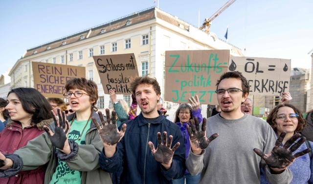 Fridays for Future activists protest outside the Federal Chancellery in Vienna on March 10, 2026, calling for a climate-friendly June budget without oil and gas subsidies. As crude oil prices rise, the impact goes far beyond Austria’s petrol stations, since the long-term costs of fossil-fuel investments are far higher due to global-warming impacts. (Photo by Joe Klamar / AFP)