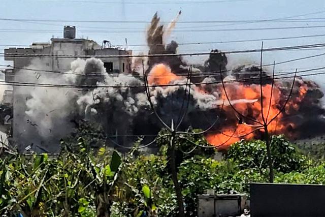 An explosion erupts following an Israeli airstrike on the village of Abbasiyeh in southern Lebanon on March 10, 2026. Lebanon was drawn into the Middle East war last week when Iran-backed militant group Hezbollah attacked Israel in response to the killing of the Iranian supreme leader during US-Israeli strikes on February 28. (Photo by KAWNAT HAJU / AFP) / Attention editors: AFP covers the war in the Middle East through its extensive regional network, including bureaus in Tehran, Jerusalem, and several neighboring countries. Since the start of the conflict, journalists have been working under increasingly restrictive conditions. Authorities in several countries have limited reporters' movements, photo and live video coverage from sensitive locations. Some governments and armed groups have banned images of missile or drone strikes and other security-related sites. / 