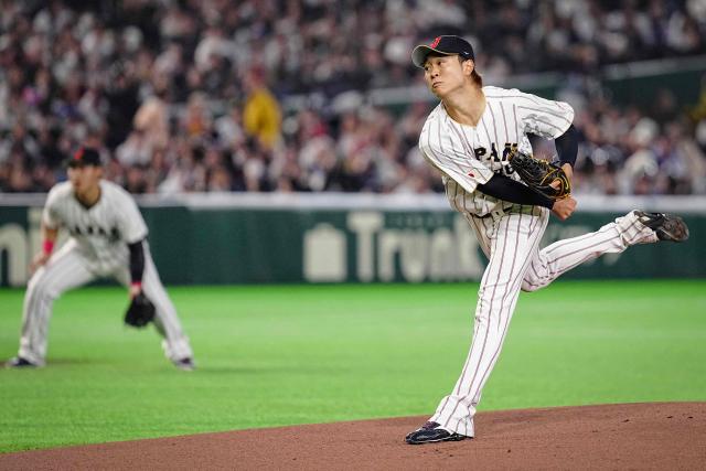 Japan's Hiroto Takahashi pitches during the World Baseball Classic (WBC) Pool C game between Japan and Czech Republic at the Tokyo Dome in Tokyo on March 10, 2026. (Photo by Yuichi YAMAZAKI / AFP)