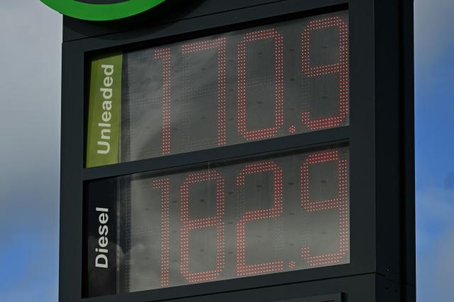 The price of unleaded and diesel fuels are pictured on a digital display board at the petrol station of a motorway services near Leicester in central England, on March 10, 2026. Oil and gas prices tumbled after US President Donald Trump said "I think the war is very complete, pretty much". World oil prices dropped by around eight percent, while the European benchmark gas price, the Dutch TTF natural gas contract, fell around 15 percent. (Photo by Oli SCARFF / AFP)