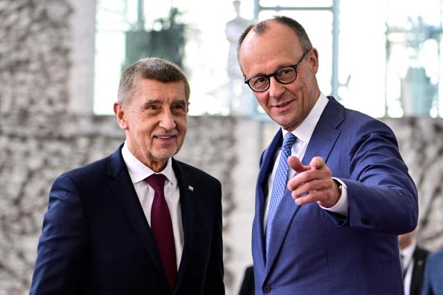 German Chancellor Friedrich Merz (R) gestures as he welcomes Czech Republic's Prime Minister Andrej Babis at the Chancellery in Berlin, Germany, on March 10, 2026. (Photo by Tobias SCHWARZ / AFP)