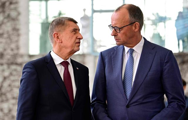 German Chancellor Friedrich Merz welcomes Czech Republic's Prime Minister Andrej Babis with military honors at the Chancellery in Berlin, Germany, on March 10, 2026. (Photo by Tobias SCHWARZ / AFP)