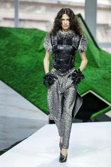 A model presents a creation for Louis Vuitton for the Women's Ready to Wear Fall/Winter 2026-2027 collection fashion show as part of the Paris Women Fashion Week, in Paris, on March 10, 2026. (Photo by Thomas SAMSON / AFP)