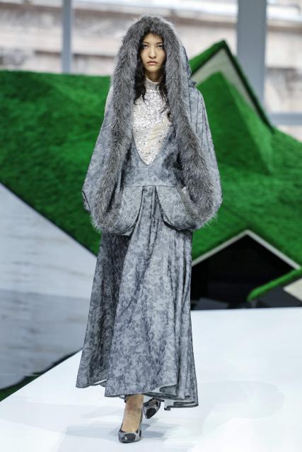 A model presents a creation for Louis Vuitton for the Women's Ready to Wear Fall/Winter 2026-2027 collection fashion show as part of the Paris Women Fashion Week, in Paris, on March 10, 2026. (Photo by Thomas SAMSON / AFP)