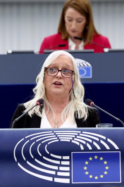 Irish activist Jackie Fox addresses members of the European Parliament as part of International Women's Day during a plenary session on March 10, 2026, in Strasbourg, eastern France. (Photo by FREDERICK FLORIN / AFP)