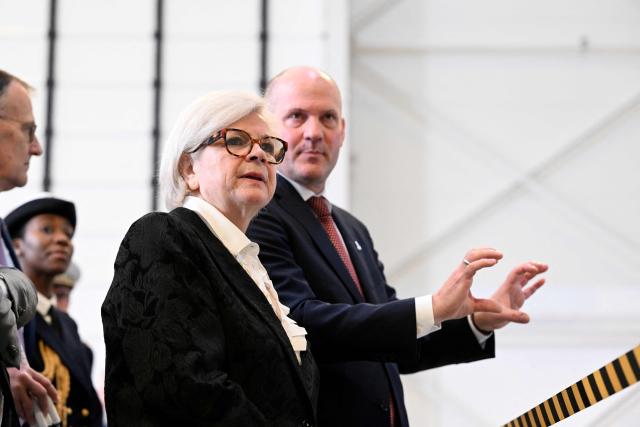 France's Defence Minister Catherine Vautrin (L) listens to Chief Operating Officer and Managing Director ArianeGroup Jens Franzeck (R) during a visit at the Ariane 6 assembly building as part of ArianeGroup's nuclear deterrence and defense activities in Les Mureaux on March 10, 2026. (Photo by Martin LELIEVRE / AFP)