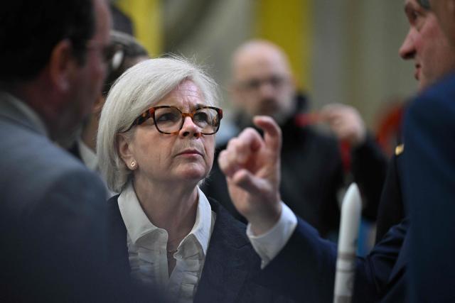 France's Defence Minister Catherine Vautrin (C) listens to Chief Operating Officer and Managing Director ArianeGroup Jens Franzeck (R) during a visit at the Ariane 6 assembly building as part of ArianeGroup's nuclear deterrence and defense activities in Les Mureaux on March 10, 2026. (Photo by Martin LELIEVRE / AFP)