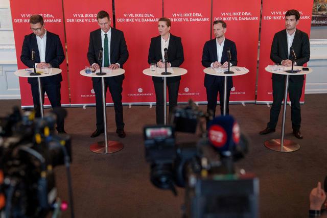 Political spokesperson Christian Rabjerg Madsen, Minister for Immigration and Integration Rasmus Stoklund, Prime Minister Mette Frederiksen, Minister of Justice Peter Hummelgaard, and spokesperson for immigration and integration Frederik Vad present the Social Democrats' immigration proposal in the party's group room at Christiansborg in Copenhagen, on March 10, 2026, as the Danish parliamentary election will be held on March 24, 2026. (Photo by Liselotte Sabroe / Ritzau Scanpix / AFP) / Denmark OUT