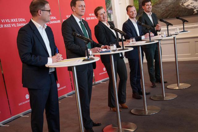 Political spokesperson Christian Rabjerg Madsen, Minister for Immigration and Integration Rasmus Stoklund, Prime Minister Mette Frederiksen, Minister of Justice Peter Hummelgaard, and spokesperson for immigration and integration Frederik Vad present the Social Democrats' immigration proposal in the party's group room at Christiansborg in Copenhagen, on March 10, 2026, as the Danish parliamentary election will be held on March 24, 2026. (Photo by Liselotte Sabroe / Ritzau Scanpix / AFP) / Denmark OUT