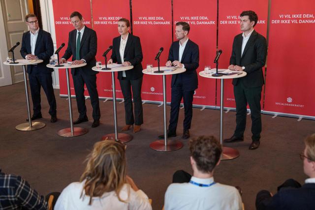 Political spokesperson Christian Rabjerg Madsen, Minister for Immigration and Integration Rasmus Stoklund, Prime Minister Mette Frederiksen, Minister of Justice Peter Hummelgaard, and spokesperson for immigration and integration Frederik Vad present the Social Democrats' immigration proposal in the party's group room at Christiansborg in Copenhagen, on March 10, 2026, as the Danish parliamentary election will be held on March 24, 2026. (Photo by Liselotte Sabroe / Ritzau Scanpix / AFP) / Denmark OUT