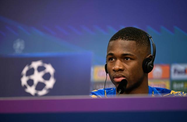 Bayer Leverkusen's Cameroonian forward #35 Christian Kofane attends a press conference prior to the UEFA Champions League - last 16 first leg soccer match Bayer Leverkusen (GER) v Arsenal (ENG) at BayArena in Leverkusen on March 10, 2026. (Photo by Ina FASSBENDER / AFP)