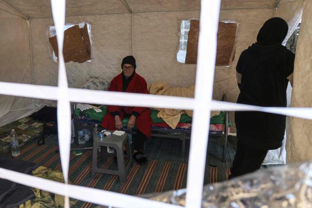 A displaced elderly man sits inside his tent at the Camille Chamoun Sports City stadium, which was converted into a reception and shelter facility for displaced people, in Beirut on March 10, 2026. Lebanon was drawn into the Middle East war last week when Iran-backed militant group Hezbollah attacked Israel in response to the killing of the Iranian supreme leader during US-Israeli strikes. (Photo by Anwar AMRO / AFP) / Attention editors: AFP covers the war in the Middle East through its extensive regional network, including bureaus in Tehran, Jerusalem, and several neighboring countries. Since the start of the conflict, journalists have been working under increasingly restrictive conditions. Authorities in several countries have limited reporters' movements, photo and live video coverage from sensitive locations. Some governments and armed groups have banned images of missile or drone strikes and other security-related sites. / 