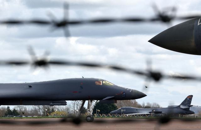 US Air Force (USAF) B-1 Lancer bomber jets stand parked on the tarmac at RAF Fairford in south-west England on March 10, 2026. Fairford is one of two bases, along with the Diego Garcia facility in the Indian Ocean, that the UK has given the US permission to use for "specific defensive operations into Iran" to destroy Iranian missiles at source, the British defence minister said in a statement. (Photo by Henry Nicholls / AFP)