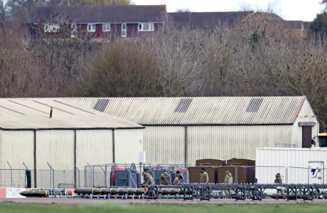 Members of the US Air Force (USAF) prepare munitions at RAF Fairford in south-west England on March 10, 2026, after USAF B-1 Lancer bomber jets and Air Force Boeing B-52 Stratofortress bombers landed at the RAF base. Fairford is one of two bases, along with the Diego Garcia facility in the Indian Ocean, that the UK has given the US permission to use for "specific defensive operations into Iran" to destroy Iranian missiles at source, the British defence minister said in a statement. (Photo by Henry NICHOLLS / AFP)
