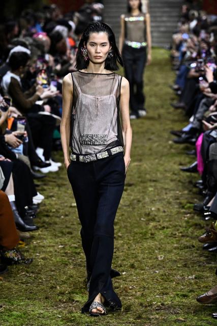 A model presents a creation for Miu Miu for the Women's Ready to Wear Fall/Winter 2026-2027 collection fashion show as part of the Paris Women Fashion Week, in Paris, on March 10, 2026. (Photo by JULIEN DE ROSA / AFP)